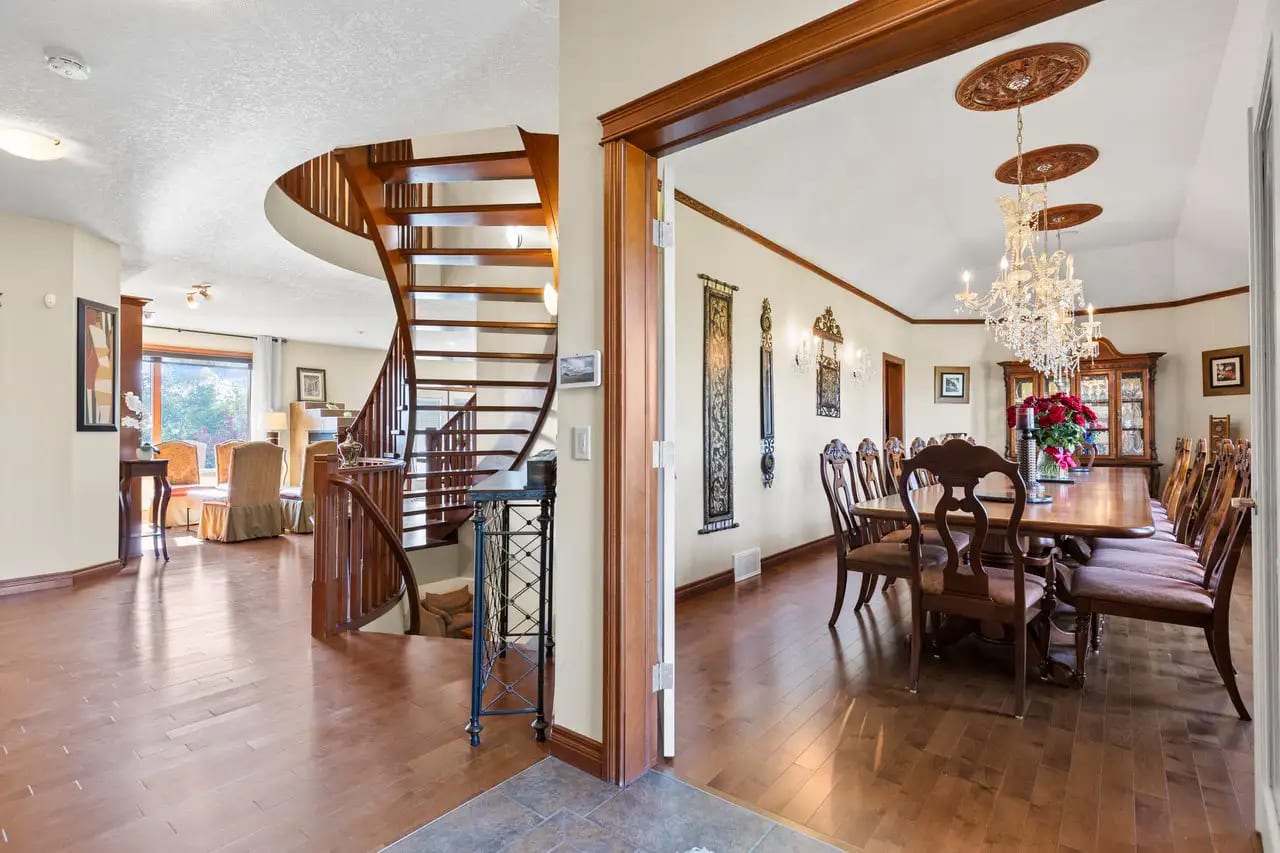 Big-dining-area-with-stairs-to-the-second-floor-professional-real-estate-photography.webp